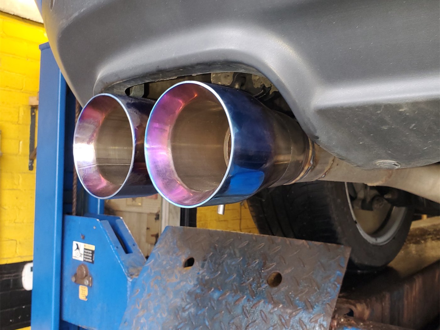 Dual exhaust tips on a car at A-1 Muffler Shop